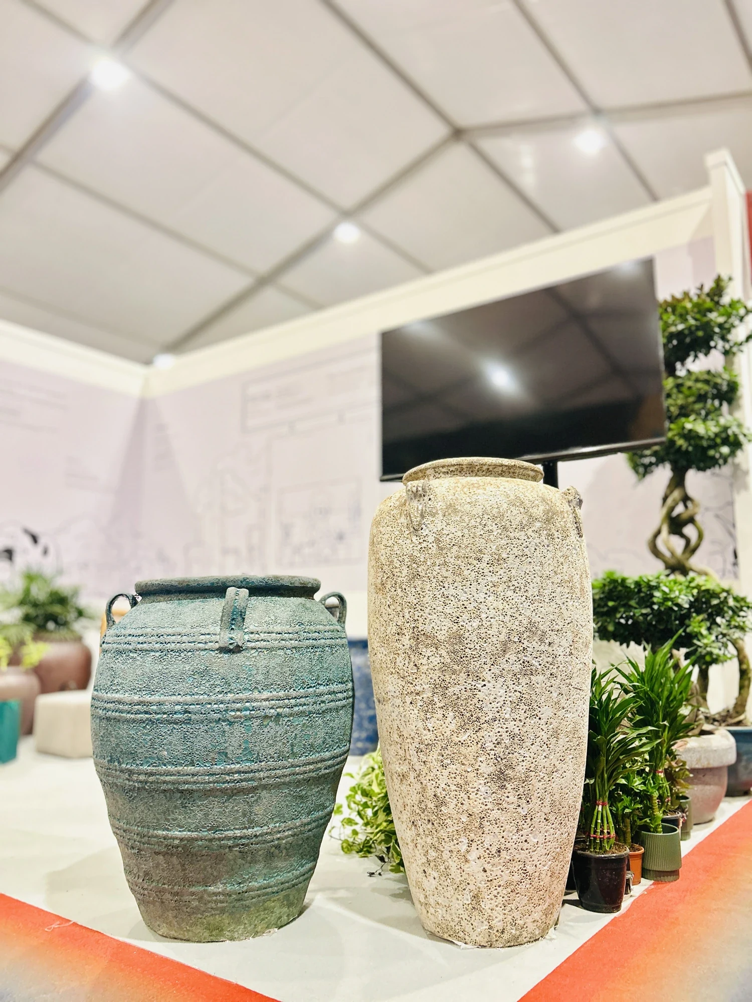 Two of the most loved ceramics from our collection — textural, hand-finished urns that anchored a corner of the stall.